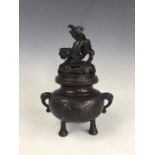 An early 20th Century Japanese bronze koro / incense burner, of oblate form with reticulated domed