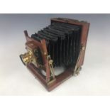 A Thornton Pickard mahogany half plate camera with patented "Time and Instantaneous" shutter