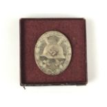 A cased German Third Reich silver wound badge