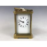 A late 19th / early 20th Century carriage clock, 11 cm excluding handle