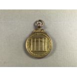 A 9ct gold 1909 East Hull Gas Co long service fob medallion, 7.4 g