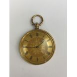A Victorian lady's high-carat yellow-metal cased fob watch, having a florally engraved face, an