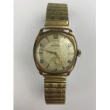 A gentleman's 9ct gold cased wristwatch, having a silvered face, subsidiary seconds, Arabic numerals