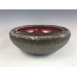 A Poole Pottery "Sunburst" pattern bowl, having combed and silvered exterior, printed marks, 26 cm