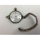An early George V lady's silver cased fob watch converted to be worn on the wrist, together with a