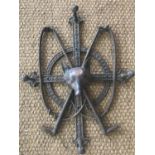 A Victorian bronzed cast-iron whip / hat rack, in the form of a cross and annulus with crossed