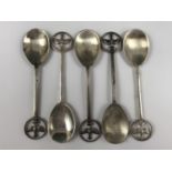 A set of five Elizabeth II silver coffee spoons, the terminals depicting a swallow delivering a