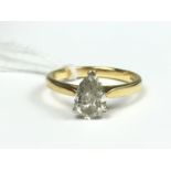 A contemporary pear-shaped solitaire ring of approximately 1ct diamond, crown set above a reverse-