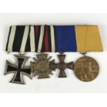 A mounted group of four German Great War medals including an Iron Cross second class
