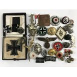 A reproduction 1939 German Iron Cross first class and other insignia