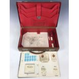 A leather writing case, together with a collection of cigarette cards etc.