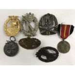 A quantity of reproduction German Third Reich insignia etc