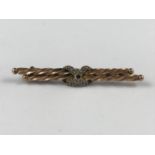 An antique yellow-metal and split seed pearl bar brooch, stamped 9ct, 2.6g