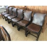 Six 1930s hide upholstered oak dining chairs