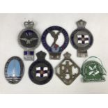 Vintage car bumper badges including those of the 'Royal Air Forces Association', 'RAC', 'Royal