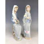 Two Lladro figurines modelled as women with flowers