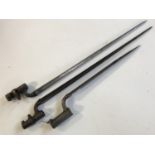 Two Pattern 1876 Martini Henry bayonets and a Pattern 1842 bayonet