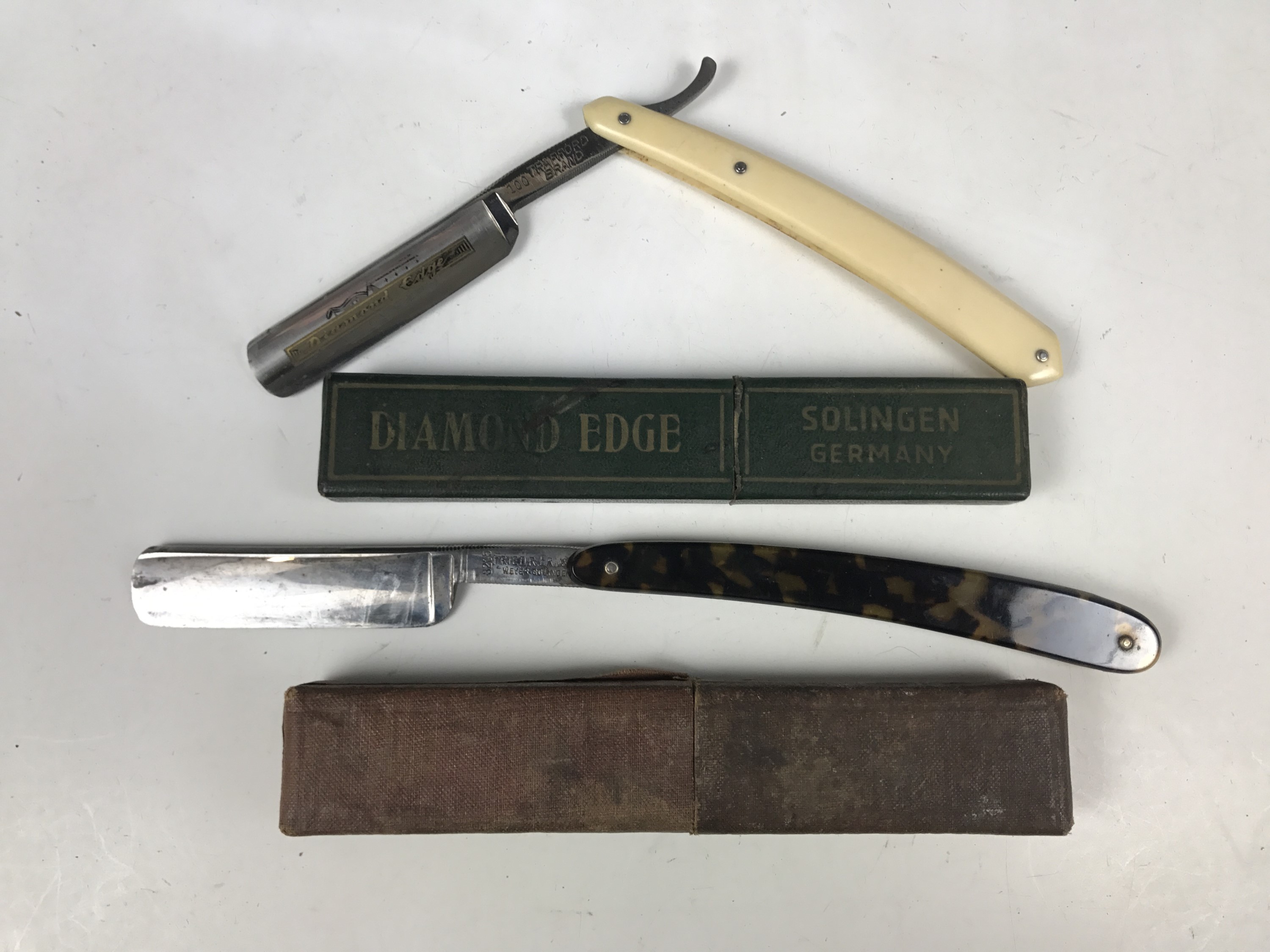 A Diamond Edge straight / cut-throat razor together with one other