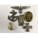 A small quantity of Third Reich insignia including a veterans' association cap badge