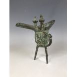An archaic style Chinese bronze lamp / vessel