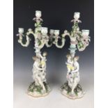 A pair of late 19th / early 20th Century German porcelain figural candelabra, 52 cm