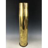 A 1960s 105mm brass shell case