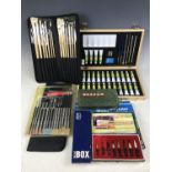 Three sets of Crimson & Blake artist's brushes together with three boxes of watercolours, a box of