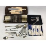 Cased electroplate fish servers and eaters together with two electroplate sugar tongs etc