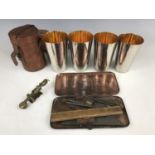 A vintage leather-cased set of four electroplate nesting / stacking beakers, together with a "