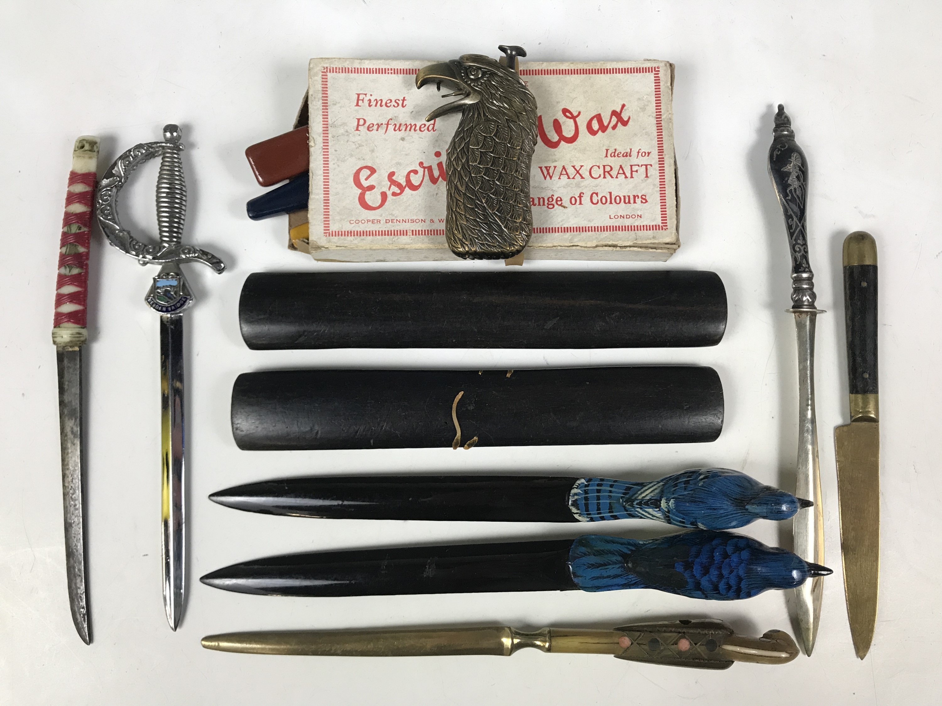 A collection of paper / letter knives, boxed sealing wax, straight edges and a novelty lighter