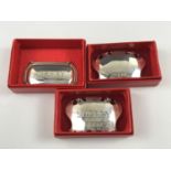 Boxed Elizabeth II silver bottle tickets, including two 'Sherry' tags and one un-engraved example,