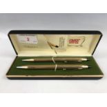 A cased Cross rolled-gold pen and propelling pencil set