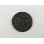 A copper livery button, 17th / 18th Century