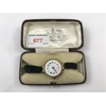 An early 20th Century lady's 9ct gold cased wrist watch, having Swiss made 15 jewel movement,