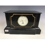 An uncommonly large Victorian black slate mantel clock, having replacement quartz movement