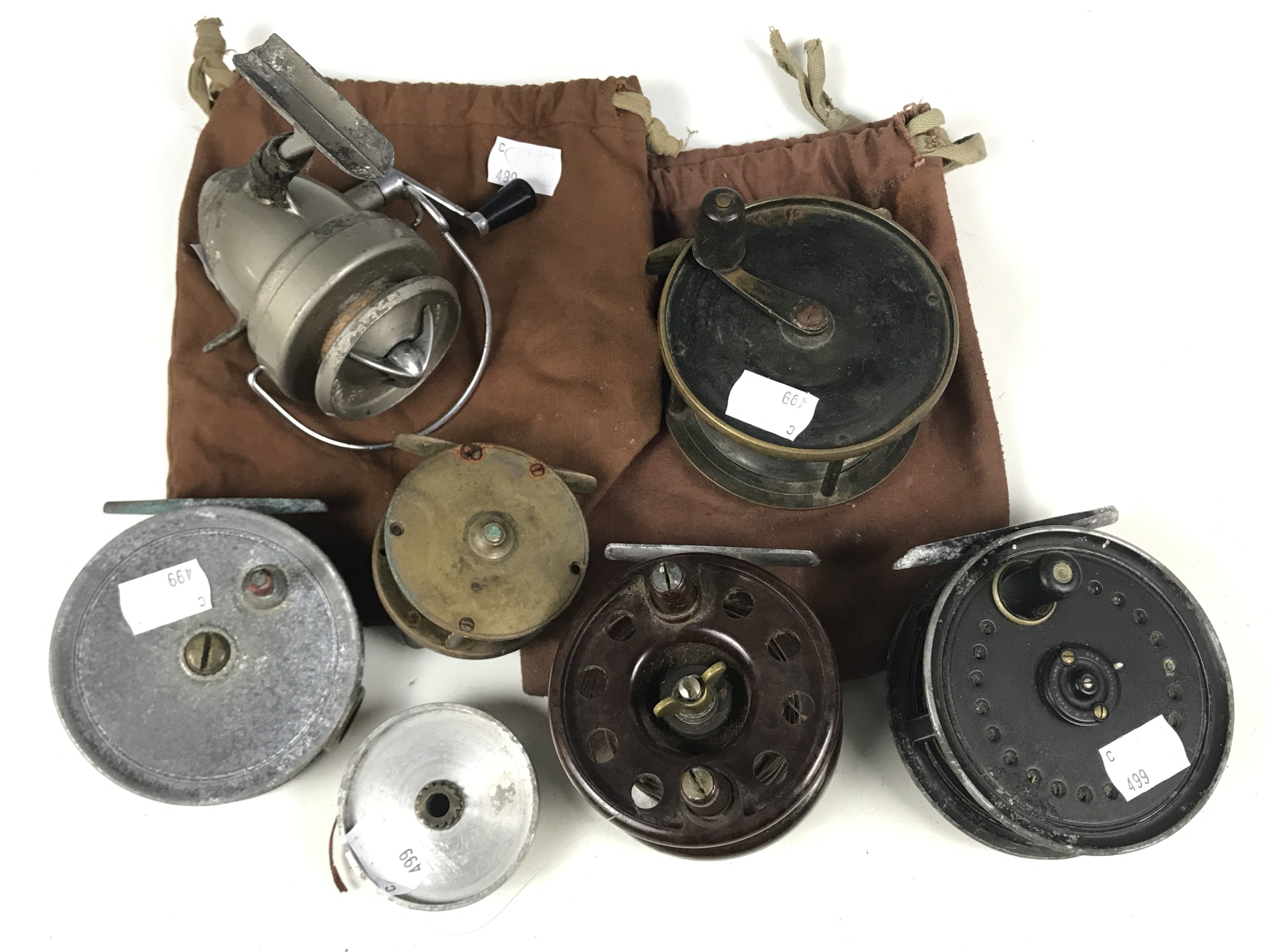 Six various vintage fishing reels including Bakelite, Alex Martin, Young's Beaudex and Turnbull of