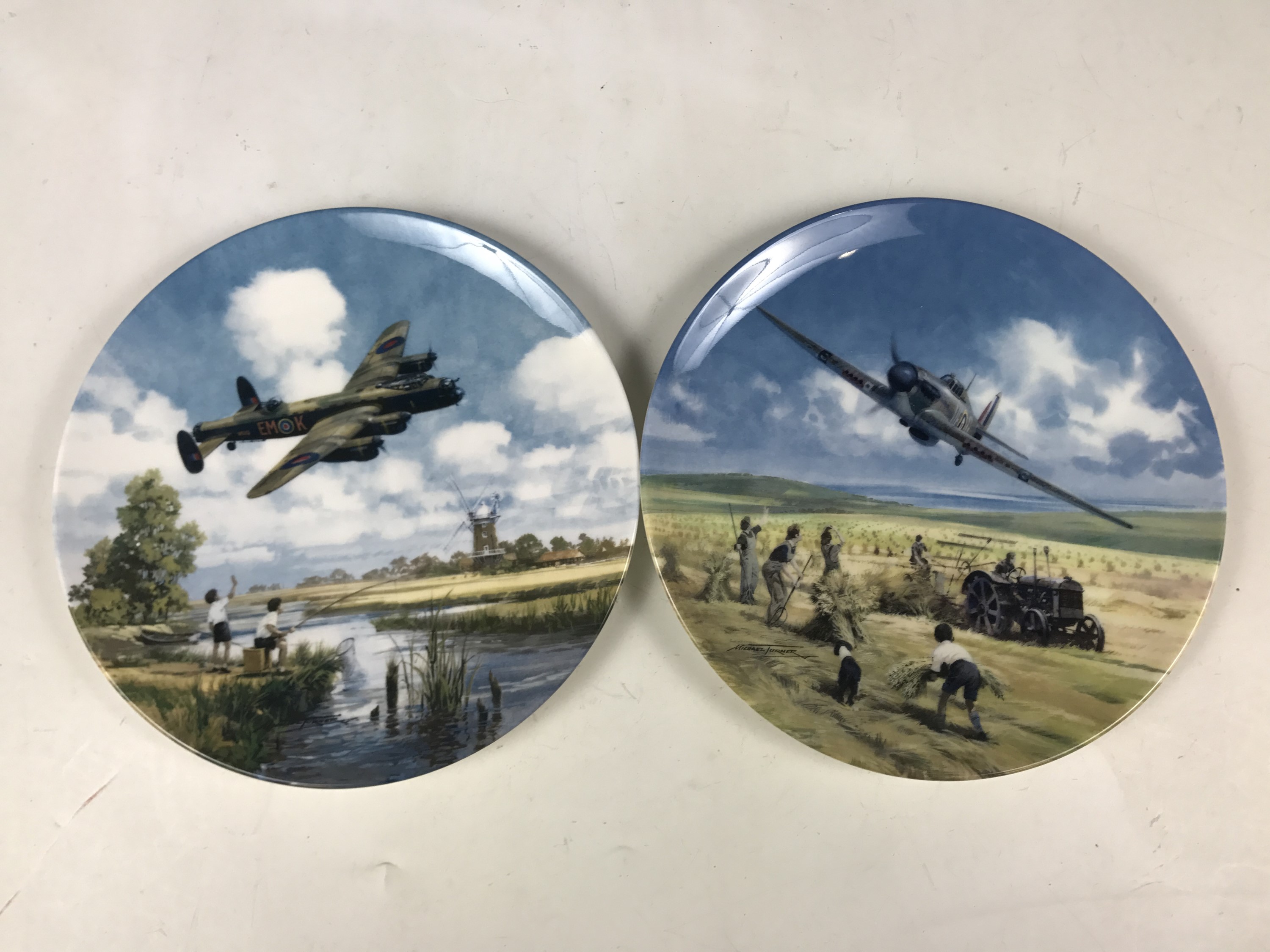 Two boxed Royal Doulton RAF plates entitled Lancaster Low Overhead and Hurricane Victory Pass