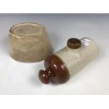 A stoneware hot water bottle together with a jelly mould