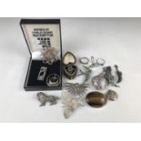 A quantity of silver and white metal jewellery including a pendant pomander, a Charles Rennie