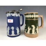 A Victorian Wedgwood blue Jasperware jug with EPBM mounts, together with one other Copeland jug