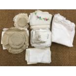 Vintage table linens, comprising white-work table cloths, embroidered napkins and crocheted coasters