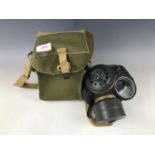 A post-War British Army gas mask with case
