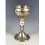 An Elizabeth II silver vase, of organic bulbous form, above a waisted and knopped stem, engraved