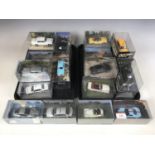Twenty-four James Bond cased model cars including a Ford GT40, a Ford Mustang convertible, a BMW