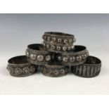 Six Middle Eastern white-metal napkin rings, stamped '92.5 Oman', test as silver, 89.2g