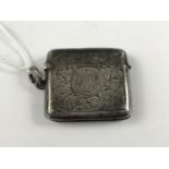 A silver vesta case, having foliate engraved decoration and monogram, 21g