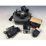 Vintage cameras and equipment, including a Pentax SuperProgram camera with Pentax-A 1:1.7 50mm lens,