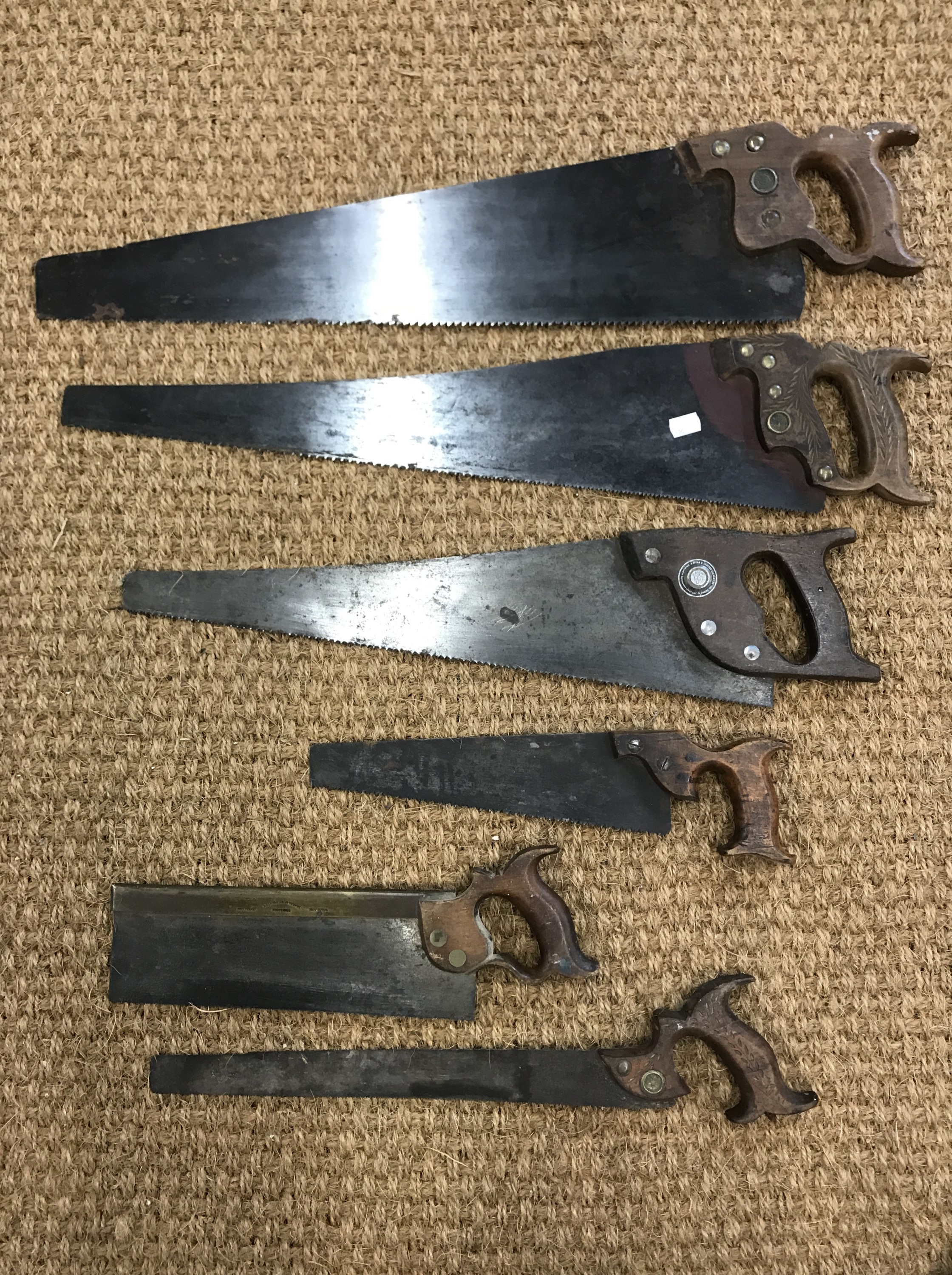 Vintage hand saws manufactured by Disston and Sons of Philadelphia and Spear & Jackson etc.