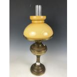A brass oil lamp with shade, 58 cm