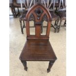 A Victorian Gothic influenced oak hall chair